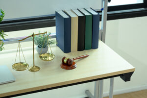 judge gavel and scales of justice putting on wooden table. lawyer, justice and legal services concept